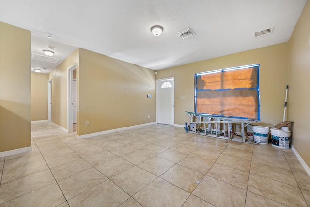 1332 SW G, Belle Glade, FL 33430 - empty room featuring tile patterned floors and baseboards