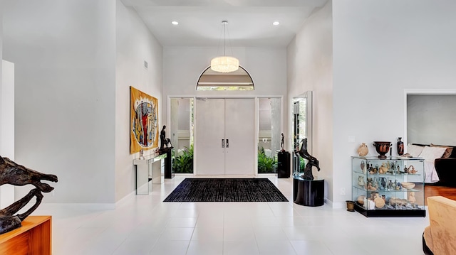 7245 Montrico Dr, Boca Raton, FL 33433 - tiled foyer entrance with a towering ceiling and baseboards
