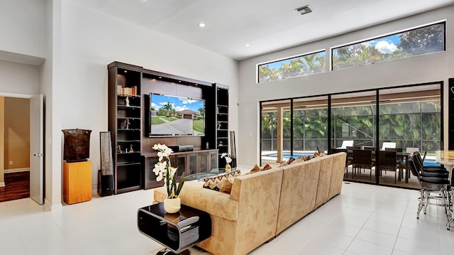 7245 Montrico Dr, Boca Raton, FL 33433 - tiled living area with a towering ceiling and recessed lighting