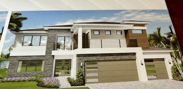 17112 Aquavera Way, Boca Raton, FL 33496 - contemporary house with a balcony, stone siding, decorative driveway, and a garage