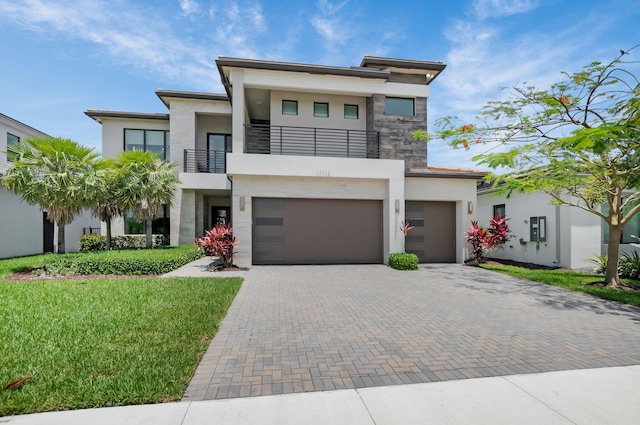17112 Aquavera Way, Boca Raton, FL 33496 - modern home with a balcony, stucco siding, decorative driveway, and a front lawn