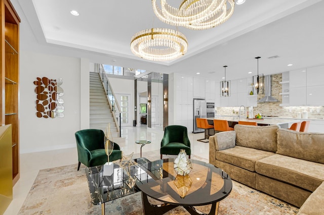 17112 Aquavera Way, Boca Raton, FL 33496 - living room with a chandelier, stairway, recessed lighting, and a tray ceiling