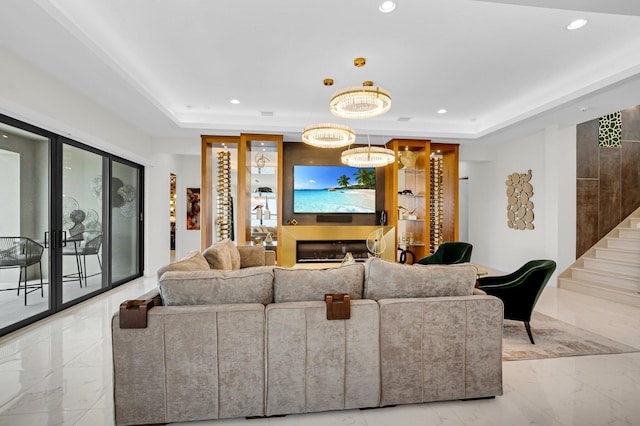 17112 Aquavera Way, Boca Raton, FL 33496 - living area with a tray ceiling, light marble finish flooring, recessed lighting, and a chandelier
