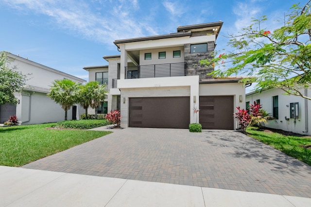 17112 Aquavera Way, Boca Raton, FL 33496 - contemporary home with a balcony, decorative driveway, stucco siding, an attached garage, and a front lawn