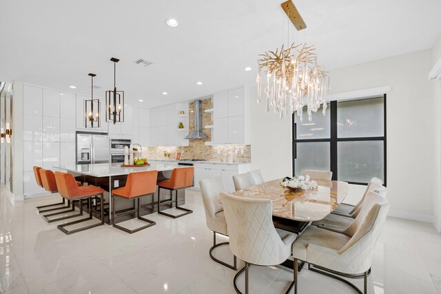 17112 Aquavera Way, Boca Raton, FL 33496 - dining area with a chandelier, light marble finish flooring, recessed lighting, and baseboards