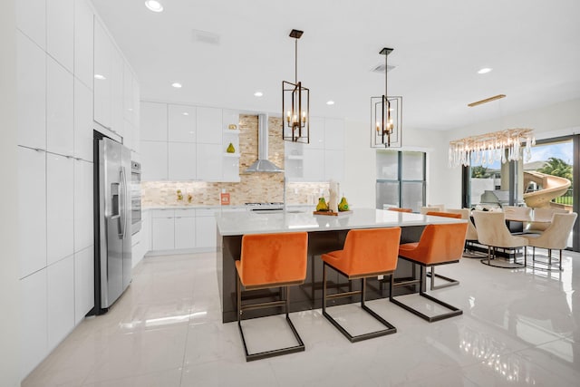 17112 Aquavera Way, Boca Raton, FL 33496 - kitchen featuring modern cabinets, stainless steel refrigerator with ice dispenser, wall chimney range hood, white cabinets, and backsplash