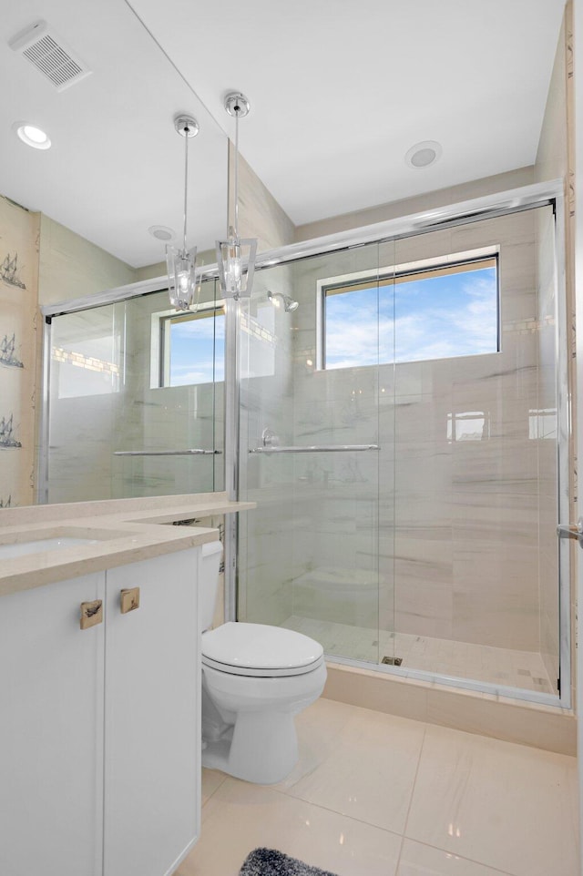 17112 Aquavera Way, Boca Raton, FL 33496 - bathroom featuring vanity, tile patterned flooring, toilet, a stall shower, and recessed lighting