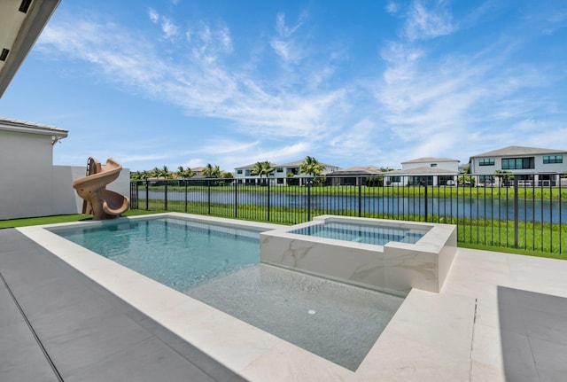 17112 Aquavera Way, Boca Raton, FL 33496 - view of pool featuring a water slide, a fenced backyard, a water view, a residential view, and a pool with connected hot tub