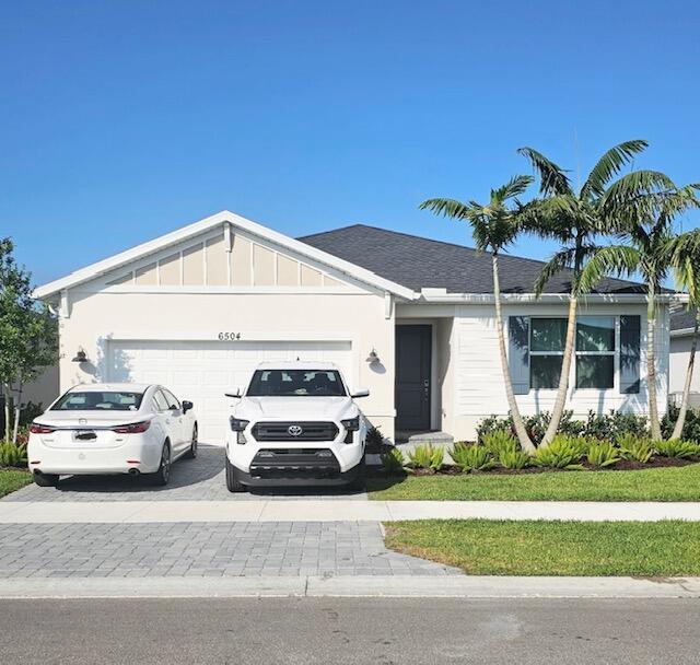 6504 Cloverdale Ave, Port Saint Lucie, FL 34987 - ranch-style home featuring driveway and a garage