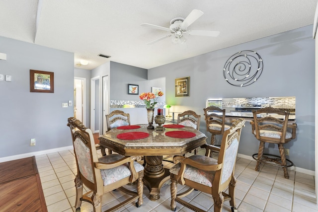 6166 Brandon St, Palm Beach Gardens, FL 33418 - dining area featuring light tile patterned floors, a ceiling fan, and baseboards