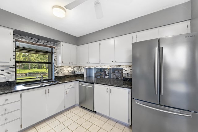 6166 Brandon St, Palm Beach Gardens, FL 33418 - kitchen with stainless steel appliances, a sink, backsplash, white cabinetry, and ceiling fan