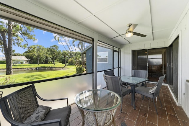 6166 Brandon St, Palm Beach Gardens, FL 33418 - sunroom / solarium with ceiling fan, outdoor dining space, and a water view
