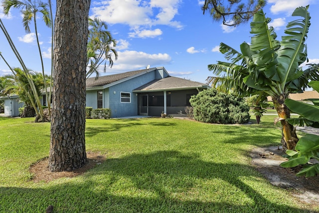 6166 Brandon St, Palm Beach Gardens, FL 33418 - view of grassy yard with a sunroom