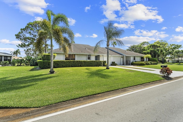 6166 Brandon St, Palm Beach Gardens, FL 33418 - single story home featuring a garage, driveway, and a front yard