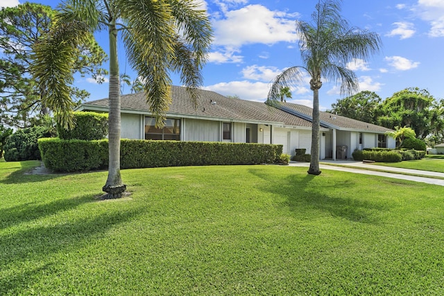6166 Brandon St, Palm Beach Gardens, FL 33418 - single story home with a garage, a front lawn, and driveway
