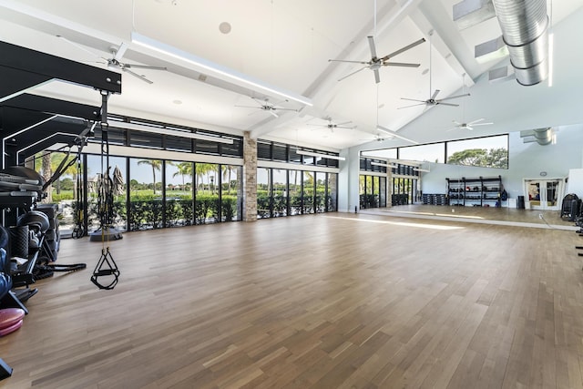 6166 Brandon St, Palm Beach Gardens, FL 33418 - exercise room featuring high vaulted ceiling, ceiling fan, wood finished floors, and beamed ceiling