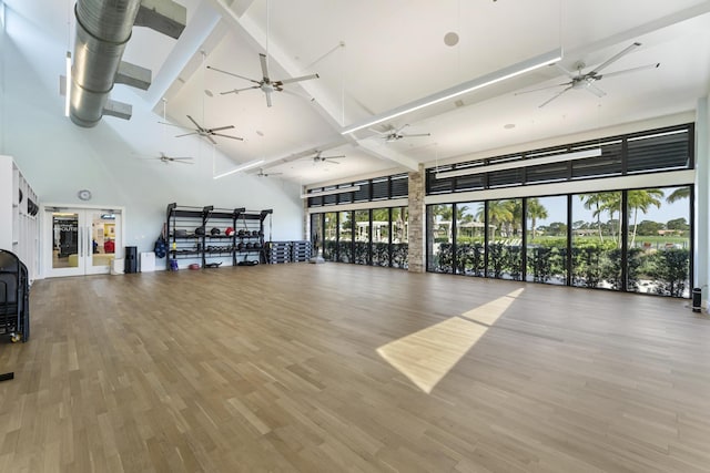 6166 Brandon St, Palm Beach Gardens, FL 33418 - workout room with high vaulted ceiling, ceiling fan, and wood finished floors