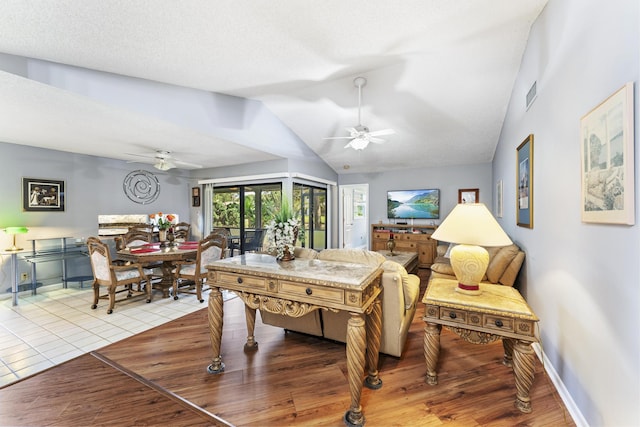 6166 Brandon St, Palm Beach Gardens, FL 33418 - living area with ceiling fan, lofted ceiling, light wood finished floors, and baseboards