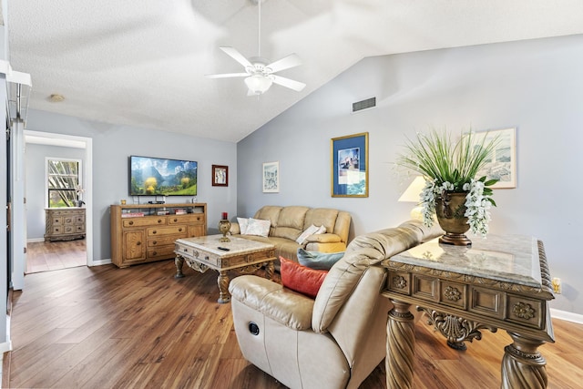 6166 Brandon St, Palm Beach Gardens, FL 33418 - living area with lofted ceiling, a ceiling fan, wood finished floors, and baseboards