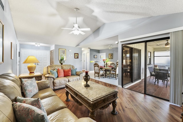 6166 Brandon St, Palm Beach Gardens, FL 33418 - living room with a ceiling fan, wood finished floors, vaulted ceiling, and a textured ceiling