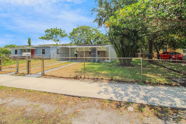 14215 NW 22nd Ct, Opa-Locka, FL 33054 - view of front facade with a gate