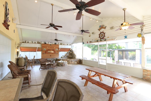 4811 Seagrape Dr, Fort Pierce, FL 34982 - living area featuring high vaulted ceiling, beam ceiling, healthy amount of natural light, light tile patterned floors, and ceiling fan
