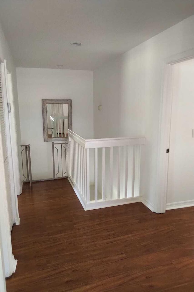 4097 Bluff Harbor Way, Wellington, FL 33449 - corridor with an upstairs landing, wood finished floors, and baseboards