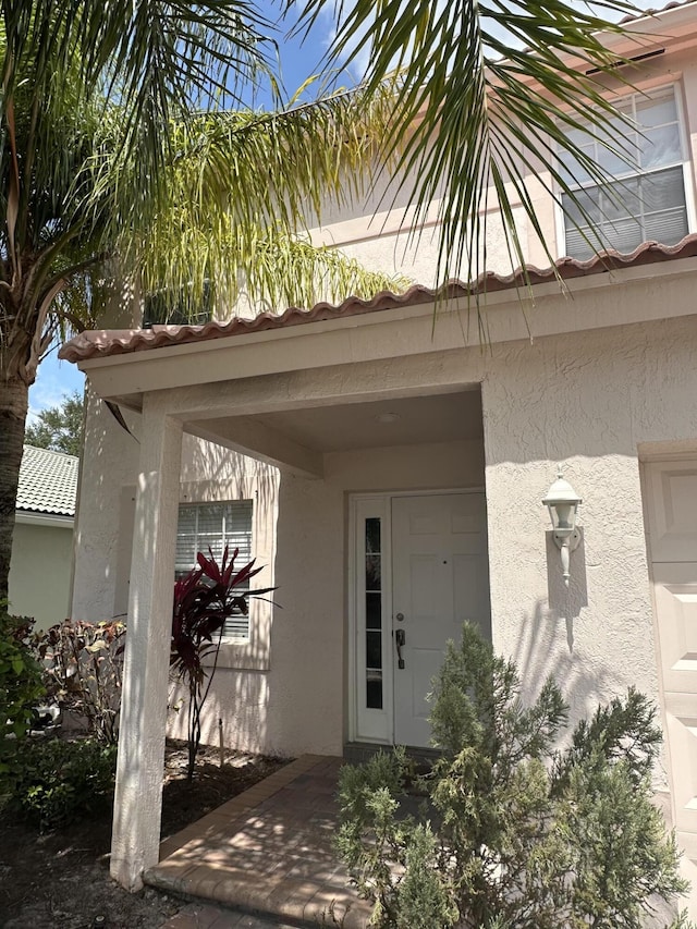 4097 Bluff Harbor Way, Wellington, FL 33449 - view of exterior entry featuring stucco siding
