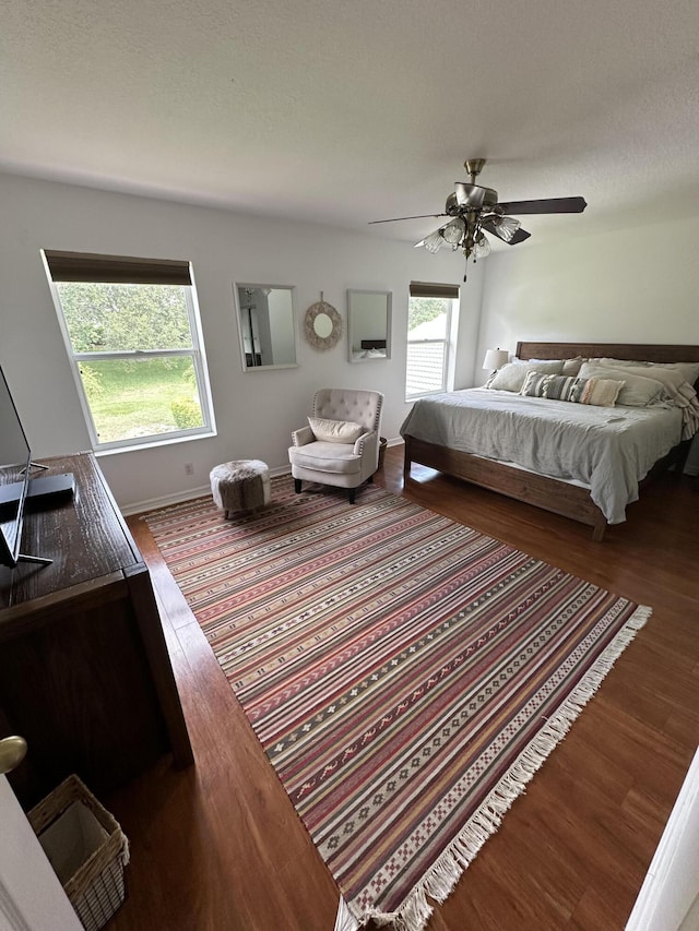 4097 Bluff Harbor Way, Wellington, FL 33449 - bedroom with wood finished floors and ceiling fan