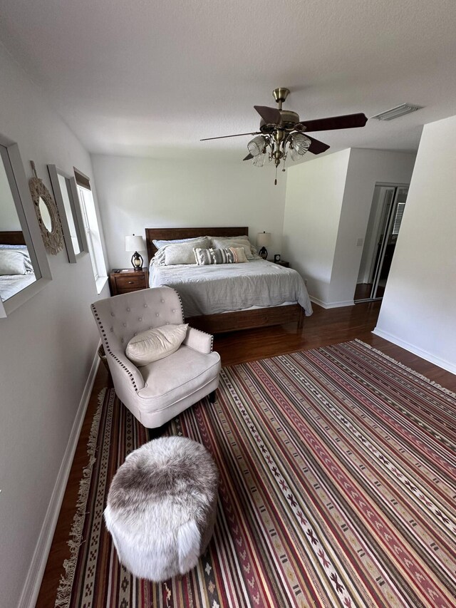 4097 Bluff Harbor Way, Wellington, FL 33449 - bedroom featuring wood finished floors, baseboards, and ceiling fan