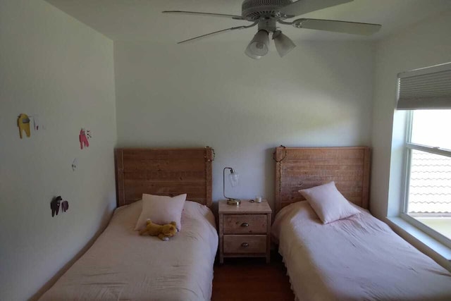 4097 Bluff Harbor Way, Wellington, FL 33449 - bedroom featuring a ceiling fan and wood finished floors