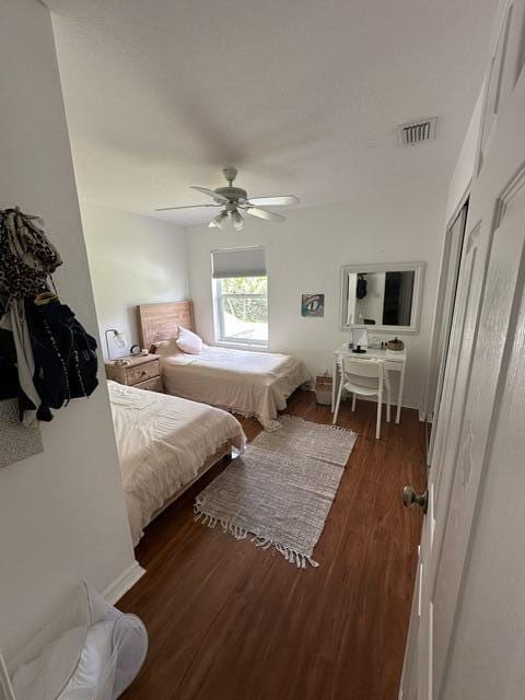 4097 Bluff Harbor Way, Wellington, FL 33449 - bedroom featuring wood finished floors and a ceiling fan