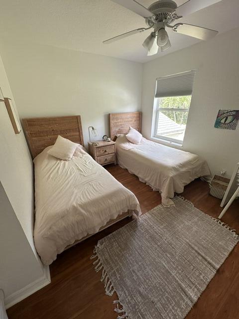 4097 Bluff Harbor Way, Wellington, FL 33449 - bedroom with wood finished floors and a ceiling fan