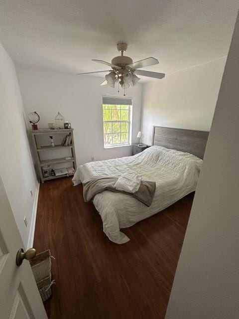 4097 Bluff Harbor Way, Wellington, FL 33449 - bedroom with wood finished floors and ceiling fan