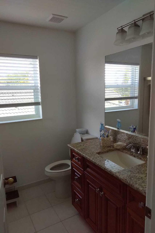 4097 Bluff Harbor Way, Wellington, FL 33449 - bathroom with vanity, plenty of natural light, toilet, and tile patterned floors