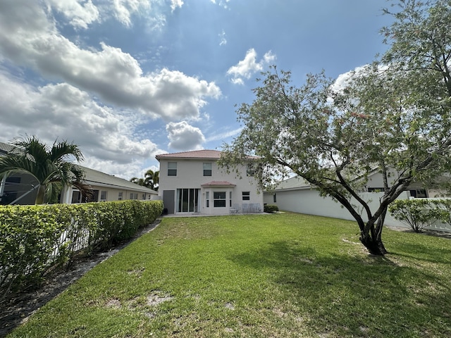 4097 Bluff Harbor Way, Wellington, FL 33449 - rear view of house with a yard and stucco siding