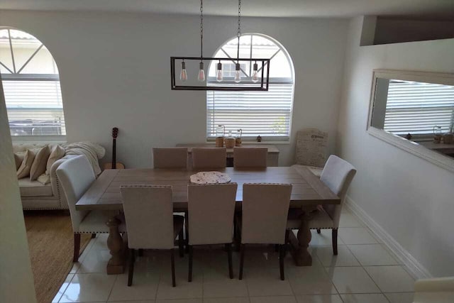 4097 Bluff Harbor Way, Wellington, FL 33449 - dining space with healthy amount of natural light, light tile patterned flooring, and baseboards