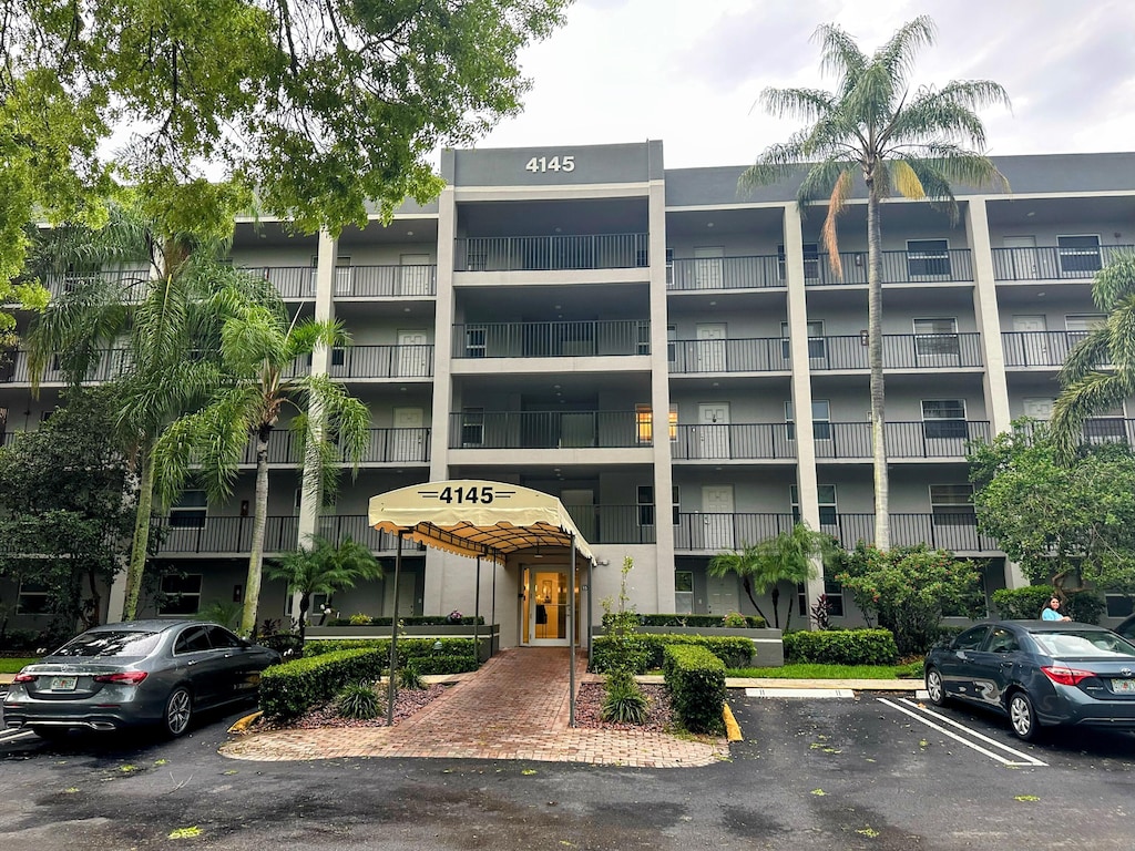 4145 Cypress Reach Ct Unit 503, Pompano Beach, FL 33069 - view of apartment building / complex with uncovered parking