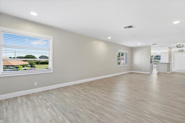 13921 Royal Palm Ct Unit D, Delray Beach, FL 33484 - unfurnished living room with light wood-style floors, baseboards, and recessed lighting