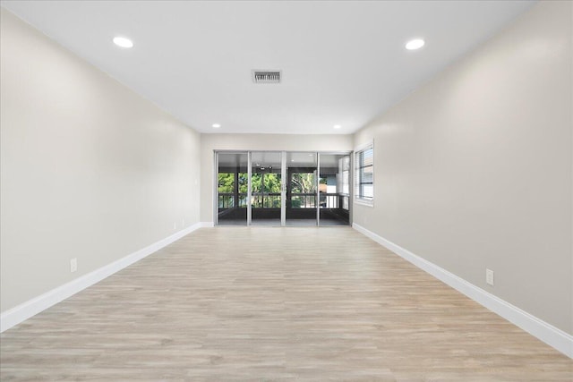 13921 Royal Palm Ct Unit D, Delray Beach, FL 33484 - unfurnished room featuring baseboards, light wood-style floors, and recessed lighting