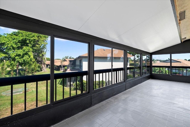 13921 Royal Palm Ct Unit D, Delray Beach, FL 33484 - unfurnished sunroom with vaulted ceiling and a residential view