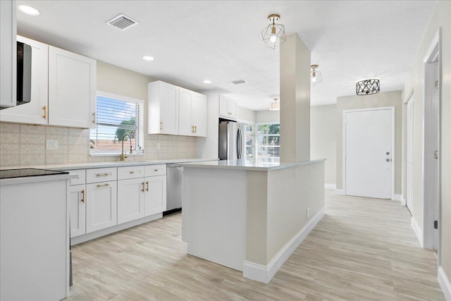 13921 Royal Palm Ct Unit D, Delray Beach, FL 33484 - kitchen with a sink, appliances with stainless steel finishes, white cabinetry, healthy amount of natural light, and recessed lighting