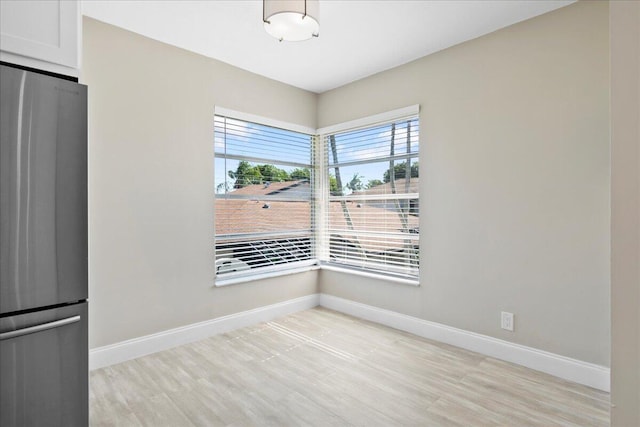 13921 Royal Palm Ct Unit D, Delray Beach, FL 33484 - unfurnished dining area featuring baseboards and light wood-style flooring