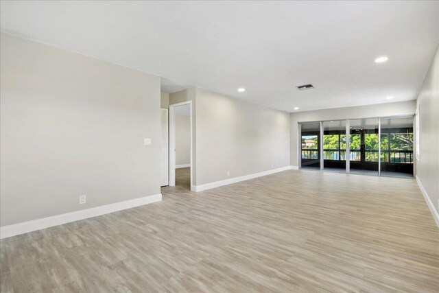 13921 Royal Palm Ct Unit D, Delray Beach, FL 33484 - empty room with baseboards, light wood finished floors, and recessed lighting