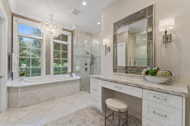 7703 Bold Lad Rd, Palm Beach Gardens, FL 33418 - bathroom featuring a bath, vanity, a stall shower, ornamental molding, and a chandelier
