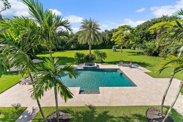 7703 Bold Lad Rd, Palm Beach Gardens, FL 33418 - view of pool with a lawn, a patio, and a pool with connected hot tub