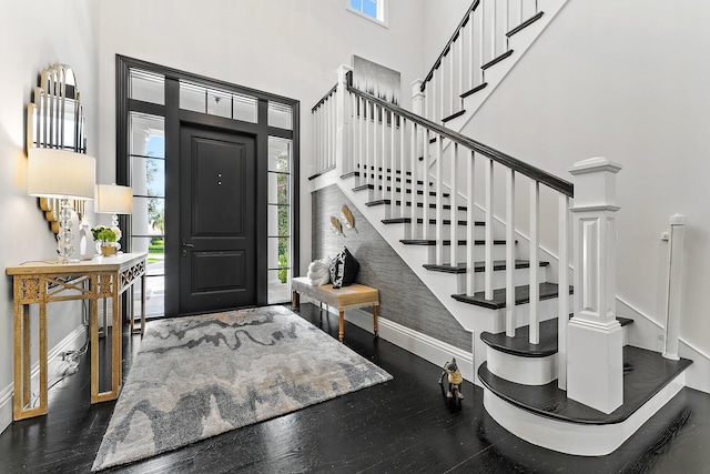 7703 Bold Lad Rd, Palm Beach Gardens, FL 33418 - foyer featuring baseboards, plenty of natural light, a high ceiling, wood finished floors, and stairway
