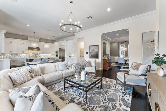 7703 Bold Lad Rd, Palm Beach Gardens, FL 33418 - living room featuring a chandelier, ornamental molding, wood finished floors, and recessed lighting