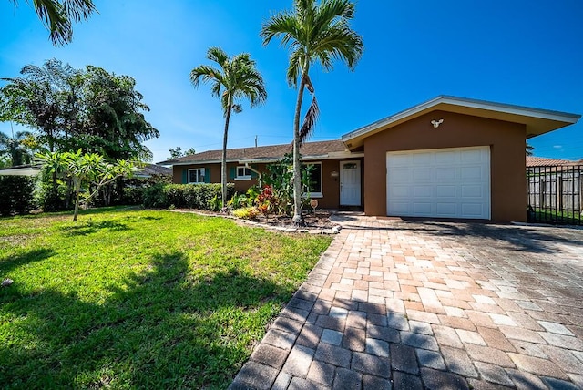 1950 N Conference Dr, Boca Raton, FL 33486 - ranch-style home with stucco siding, an attached garage, and decorative driveway