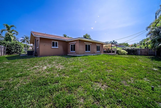 1950 N Conference Dr, Boca Raton, FL 33486 - back of property featuring stucco siding and central AC unit